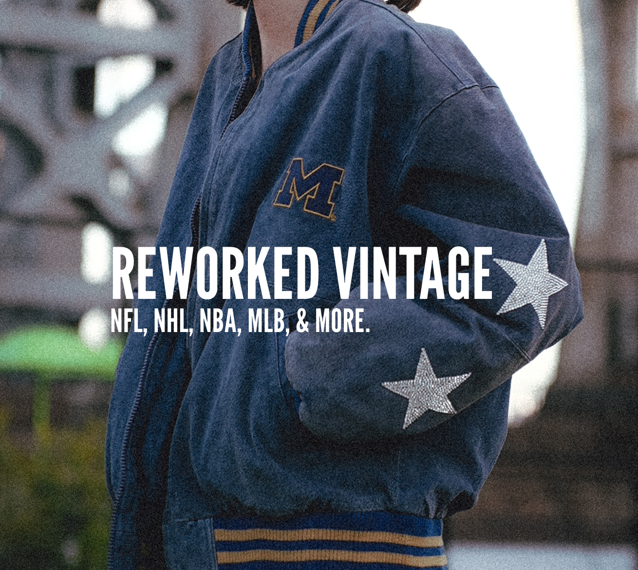 Person wearing a blue jacket with star designs and text overlay 'REWORKED VINTAGE NFL, NHL, NBA, MLB & MORE'.